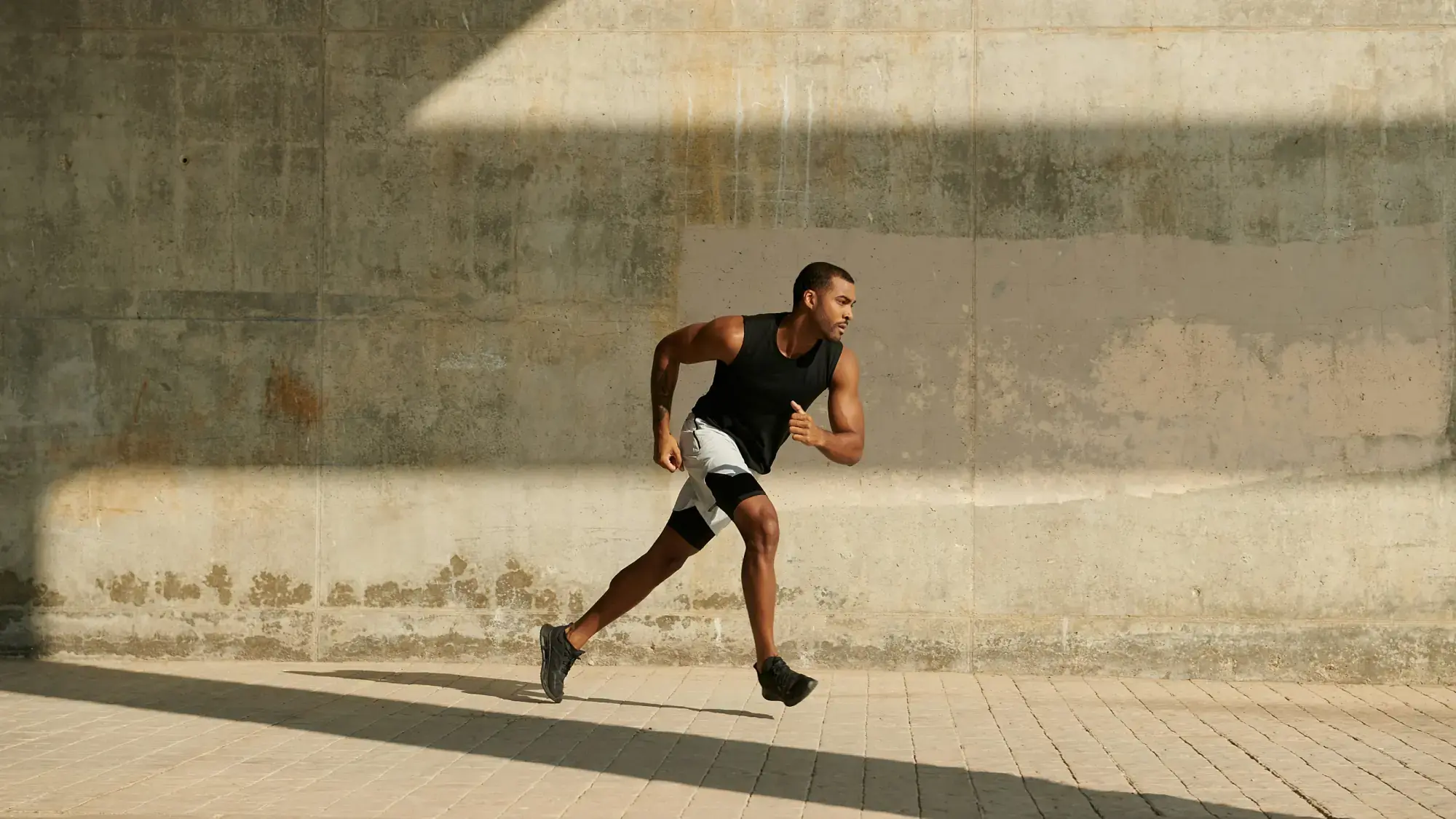 Man training outdoors, focused