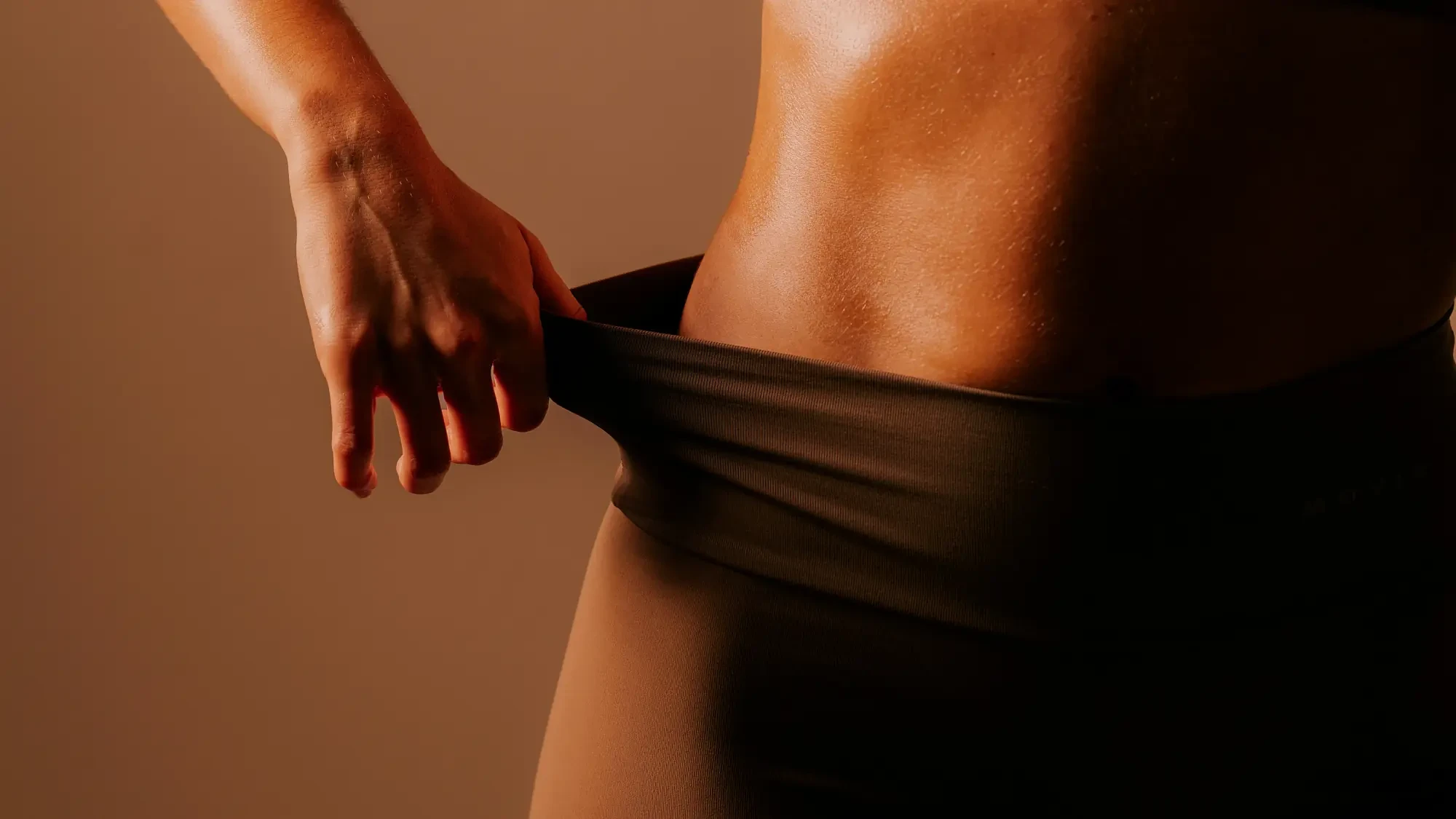 A woman in warm studio light